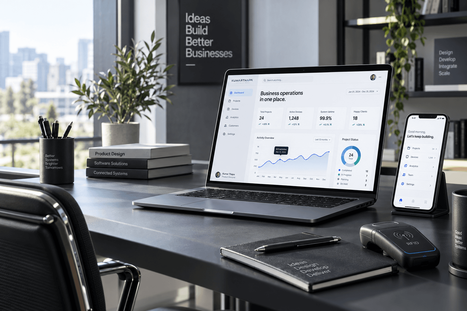 A sunlit studio desk with business dashboards on a laptop and phone, alongside an RFID reader